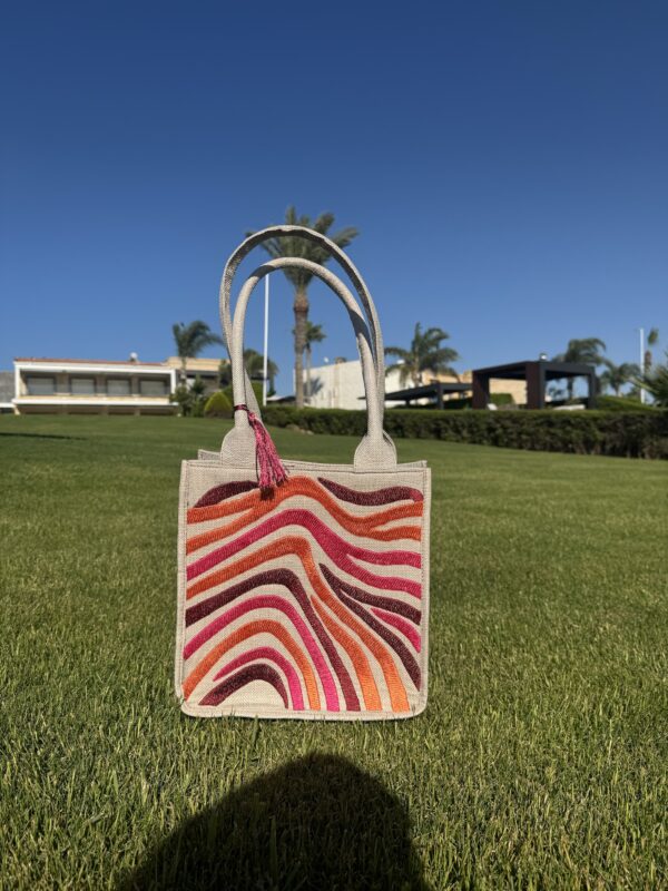 A bold blend of orange, burgundy, and fuchsia. - Image 4
