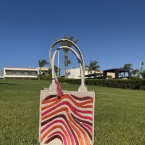 A bold blend of orange, burgundy, and fuchsia.